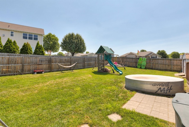 1695 Pease Dr, Pleasant Hill, IA 50327 - fenced backyard featuring a playground
