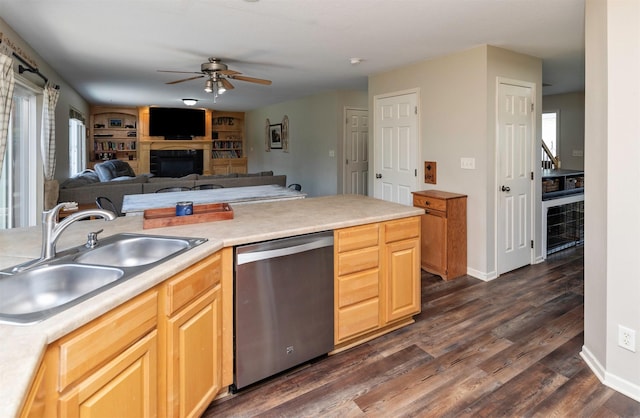 1695 Pease Dr, Pleasant Hill, IA 50327 - kitchen with dishwasher, a ceiling fan, a fireplace, light countertops, and dark wood finished floors