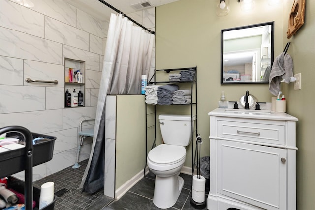 1695 Pease Dr, Pleasant Hill, IA 50327 - full bath featuring a tile shower, vanity, and tile patterned flooring