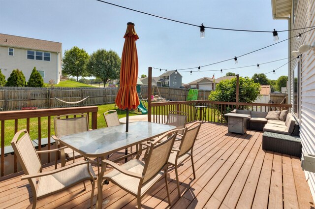 1695 Pease Dr, Pleasant Hill, IA 50327 - deck with outdoor dining space, a fenced backyard, and an outdoor living space