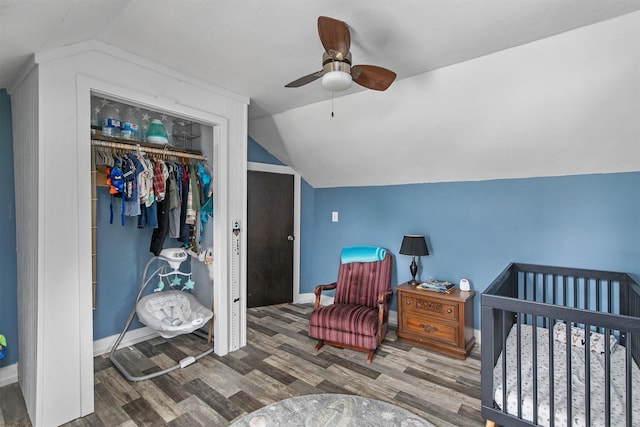 404 W Salem Ave, Indianola, IA 50125 - bedroom featuring wood finished floors, lofted ceiling, a closet, and ceiling fan