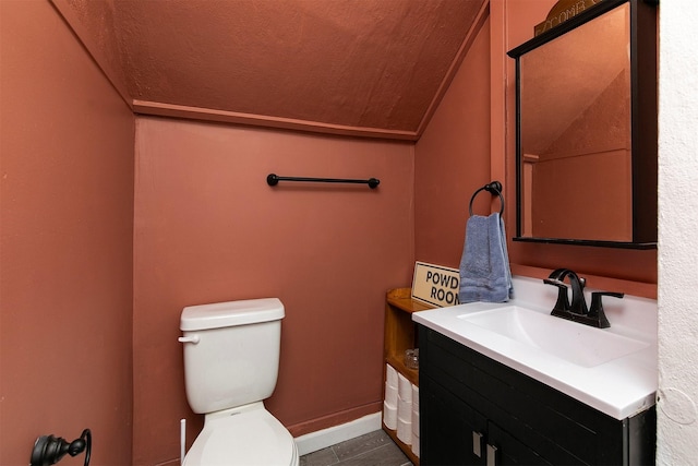 404 W Salem Ave, Indianola, IA 50125 - half bathroom featuring vaulted ceiling and vanity