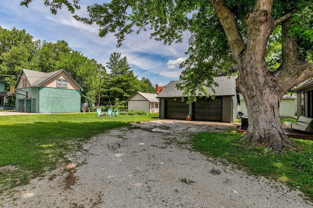 404 W Salem Ave, Indianola, IA 50125 - view of grassy yard with a detached garage