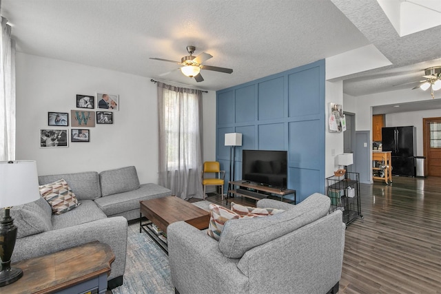 404 W Salem Ave, Indianola, IA 50125 - living room with ceiling fan, a textured ceiling, plenty of natural light, and dark wood-style flooring