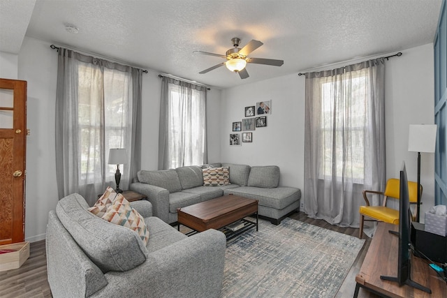 404 W Salem Ave, Indianola, IA 50125 - living room with a textured ceiling, a ceiling fan, and wood finished floors