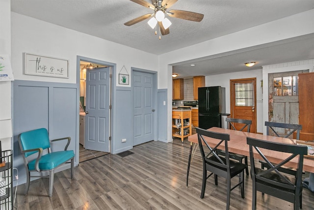 404 W Salem Ave, Indianola, IA 50125 - dining area with a textured ceiling, wood finished floors, and a ceiling fan
