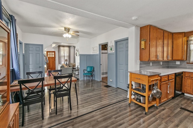 404 W Salem Ave, Indianola, IA 50125 - kitchen featuring brown cabinetry, ceiling fan, dishwasher, dark wood-style floors, and tasteful backsplash