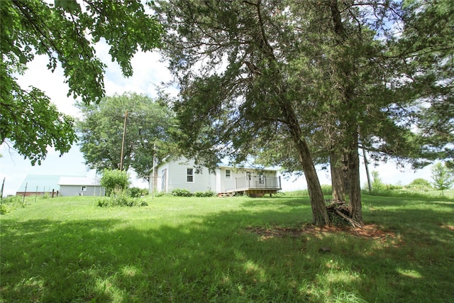 24388 250th St, Eldora, IA 50627 - view of green lawn featuring a deck