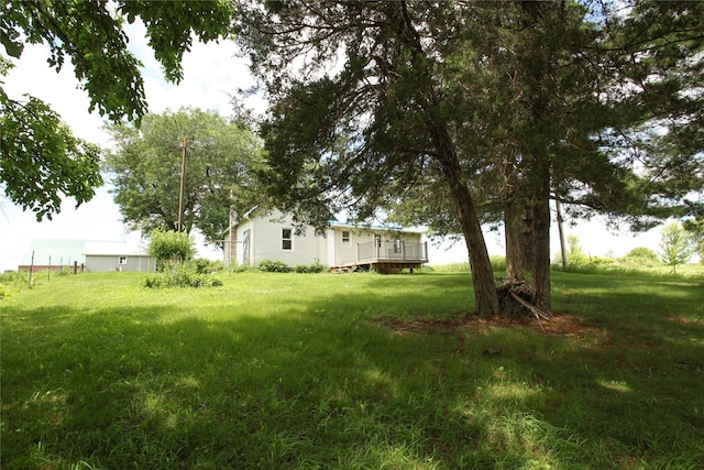 24388 250th St, Eldora, IA 50627 - view of grassy yard with a wooden deck