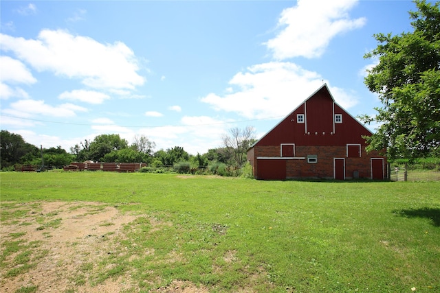 24388 250th St, Eldora, IA 50627 - view of grassy yard featuring a barn and an outdoor structure