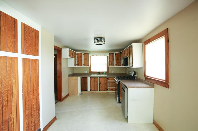 24388 250th St, Eldora, IA 50627 - kitchen with appliances with stainless steel finishes and brown cabinets