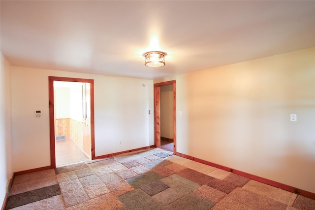 24388 250th St, Eldora, IA 50627 - spare room featuring light carpet and baseboards