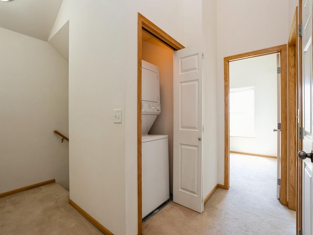 1246 SE Village View Ln, Ankeny, IA 50021 - laundry room with stacked washer / dryer and light colored carpet