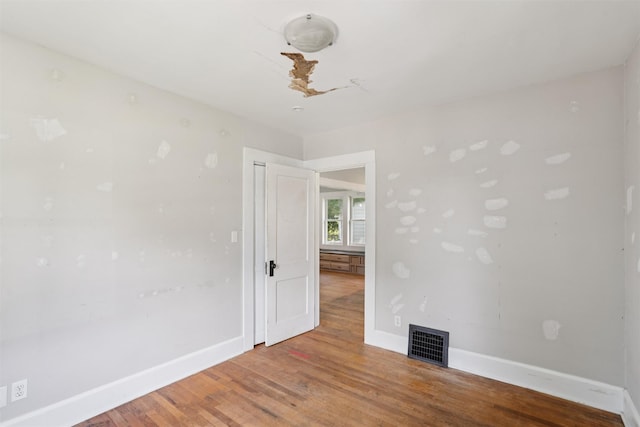 3907 50th St, Des Moines, IA 50310 - spare room featuring baseboards and wood finished floors