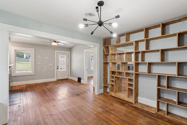 3907 50th St, Des Moines, IA 50310 - entrance foyer with a chandelier, wood-type flooring, and a ceiling fan