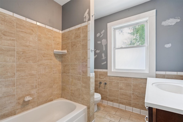 3907 50th St, Des Moines, IA 50310 - full bathroom featuring tile walls, vanity, wainscoting, bathtub / shower combination, and tile patterned flooring
