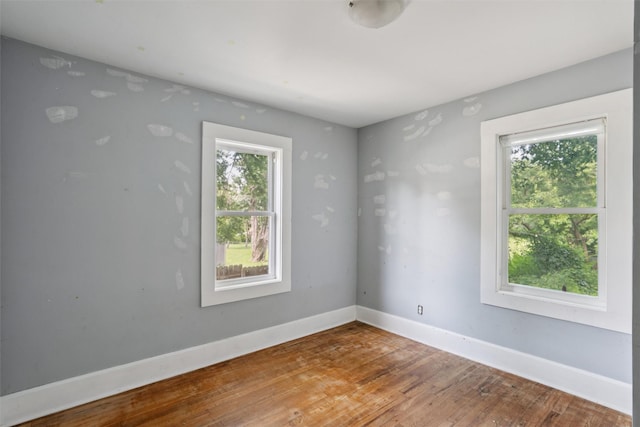 3907 50th St, Des Moines, IA 50310 - spare room with wood finished floors and baseboards