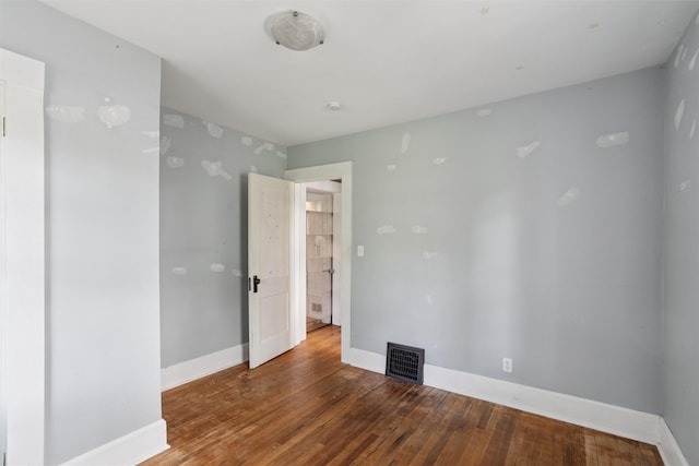 3907 50th St, Des Moines, IA 50310 - empty room with wood-type flooring and baseboards