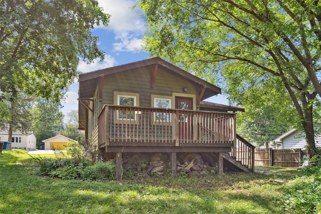 3907 50th St, Des Moines, IA 50310 - back of property featuring stairway and a wooden deck