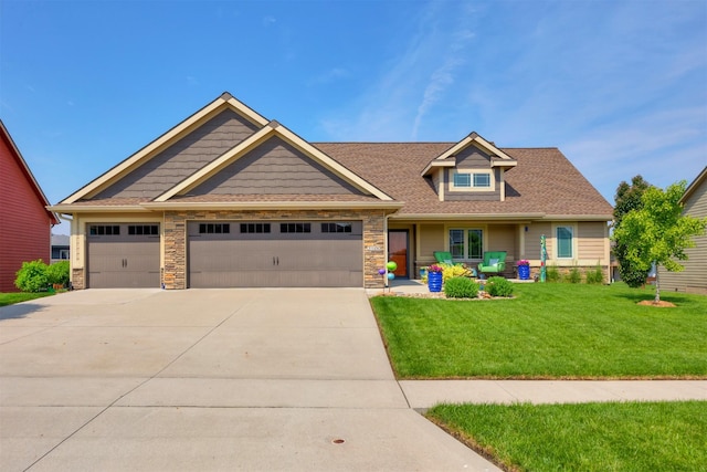 2100 NW Prairie Creek Dr, Grimes, IA 50111 - craftsman inspired home with a front yard, driveway, an attached garage, and stone siding
