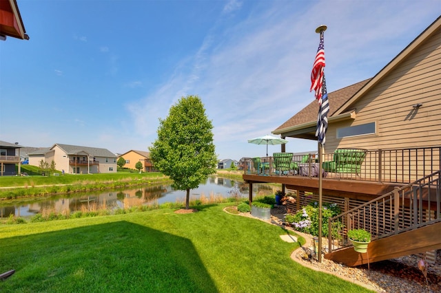 2100 NW Prairie Creek Dr, Grimes, IA 50111 - view of green lawn with a deck with water view and a residential view