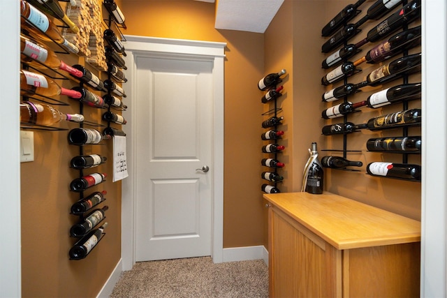 2100 NW Prairie Creek Dr, Grimes, IA 50111 - wine area with light colored carpet and baseboards