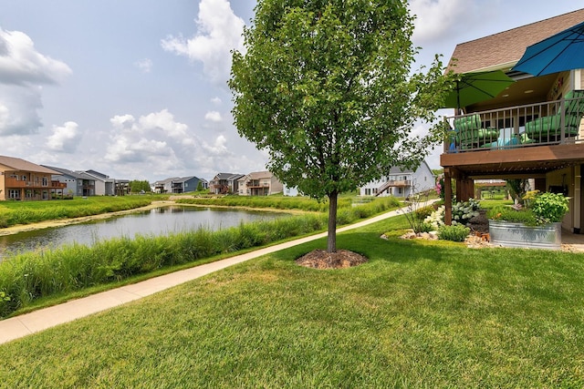 2100 NW Prairie Creek Dr, Grimes, IA 50111 - view of green lawn with a residential view and a deck with water view