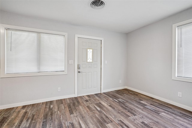 9 1st St, Collins, IA 50055 - foyer entrance featuring wood finished floors and baseboards