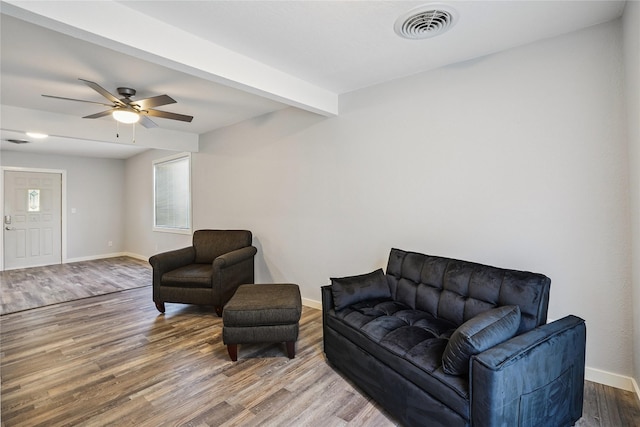 9 1st St, Collins, IA 50055 - living area with wood finished floors and ceiling fan