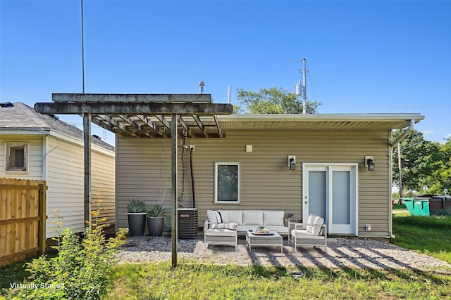 9 1st St, Collins, IA 50055 - back of property featuring outdoor lounge area, a patio area, and a pergola