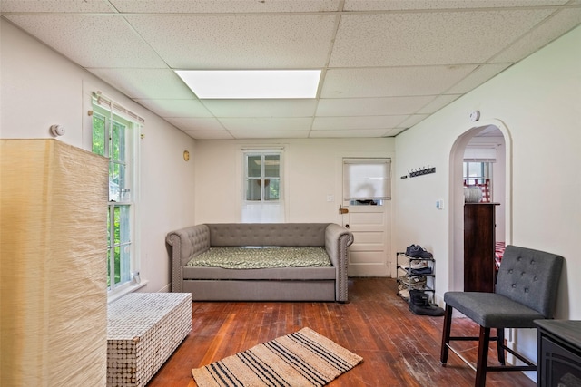 121 Cherry Ave, Ames, IA 50010 - living area featuring a drop ceiling, arched walkways, and hardwood / wood-style flooring