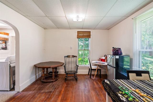 121 Cherry Ave, Ames, IA 50010 - sitting room featuring washer / dryer, a drop ceiling, arched walkways, and hardwood / wood-style flooring