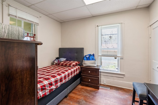 121 Cherry Ave, Ames, IA 50010 - bedroom with wood finished floors and a drop ceiling