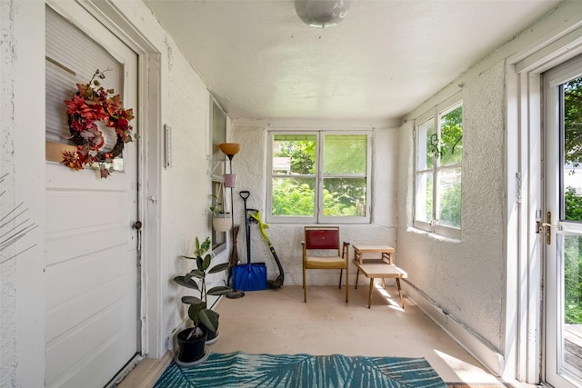 121 Cherry Ave, Ames, IA 50010 - sunroom with a textured wall and unfinished concrete floors