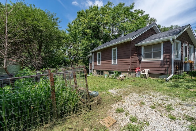 121 Cherry Ave, Ames, IA 50010 - view of side of property featuring roof with shingles