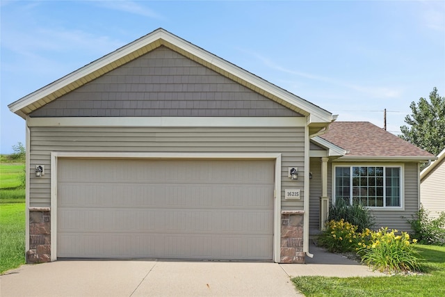 16215 Monroe Ct, Urbandale, IA 50323 - ranch-style house featuring concrete driveway, an attached garage, and a shingled roof