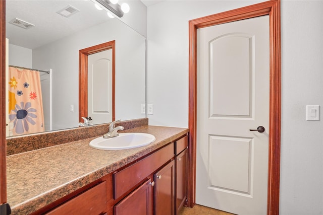 16215 Monroe Ct, Urbandale, IA 50323 - full bathroom featuring vanity and curtained shower