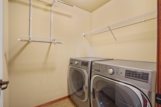 16215 Monroe Ct, Urbandale, IA 50323 - washroom featuring independent washer and dryer and baseboards