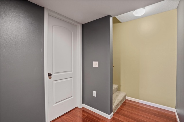 16215 Monroe Ct, Urbandale, IA 50323 - corridor with wood finished floors and stairs