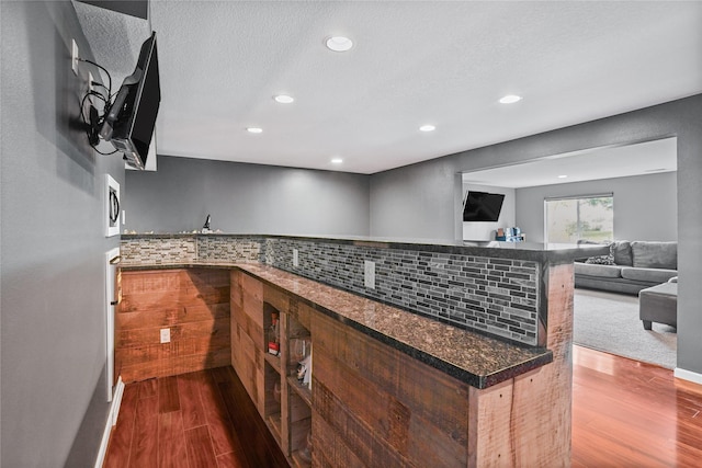 16215 Monroe Ct, Urbandale, IA 50323 - surrounding community with bar, recessed lighting, and a textured ceiling
