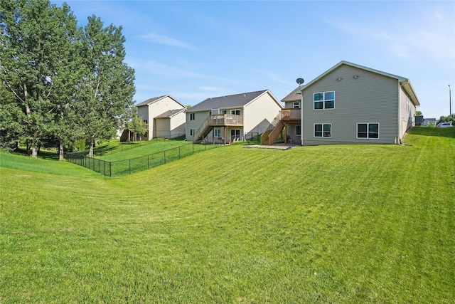 16215 Monroe Ct, Urbandale, IA 50323 - rear view of house featuring stairway and a deck