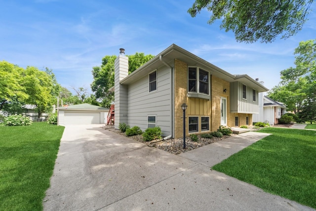 2424 Guenever Ct, Altoona, IA 50009 - split foyer home featuring a chimney, an outbuilding, a front yard, and board and batten siding