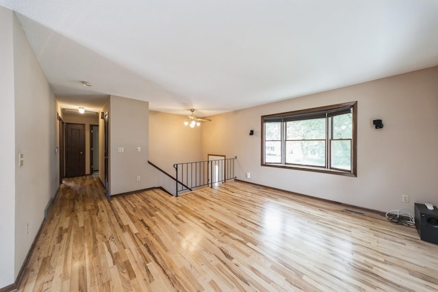 2424 Guenever Ct, Altoona, IA 50009 - empty room with light wood-style flooring and baseboards