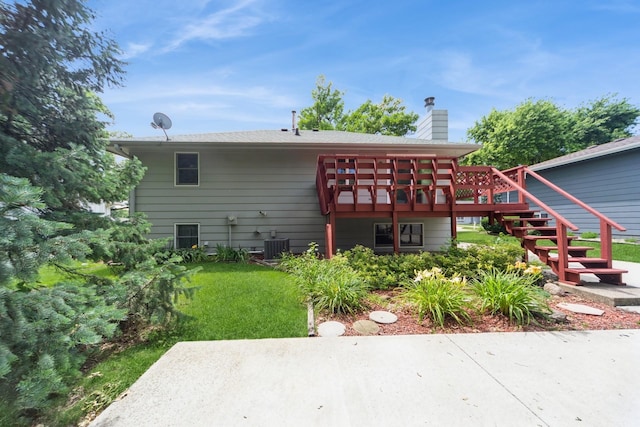 2424 Guenever Ct, Altoona, IA 50009 - rear view of property with stairs, a patio area, a deck, a chimney, and a lawn