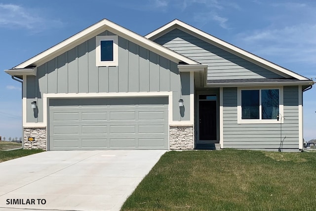 1435 Locust St, Waukee, IA 50263 - ranch-style home featuring a garage, concrete driveway, a front lawn, and stone siding