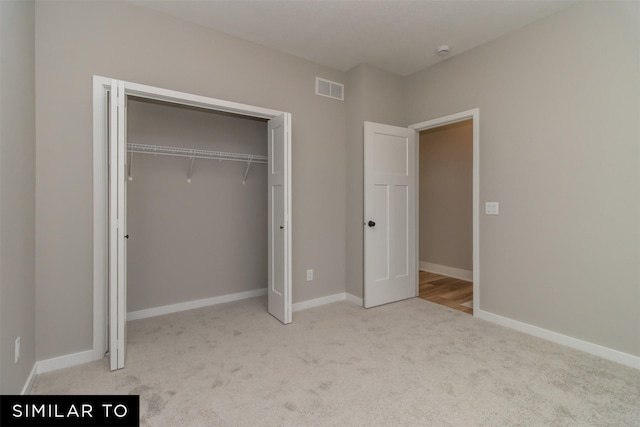 1435 Locust St, Waukee, IA 50263 - unfurnished bedroom featuring carpet floors and a closet