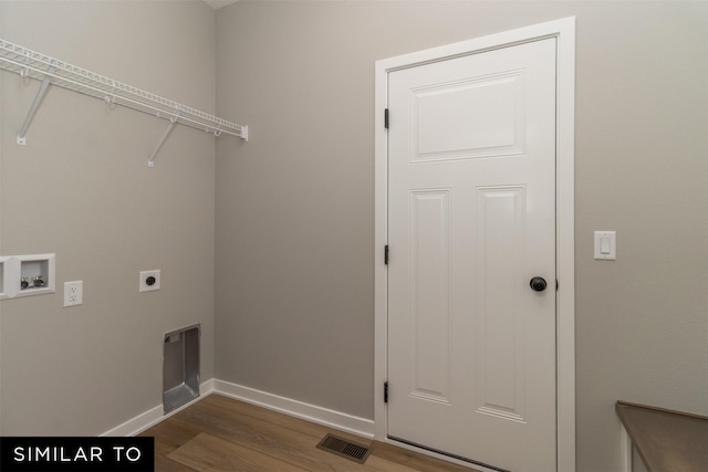 1435 Locust St, Waukee, IA 50263 - laundry room with electric dryer hookup, washer hookup, and wood finished floors