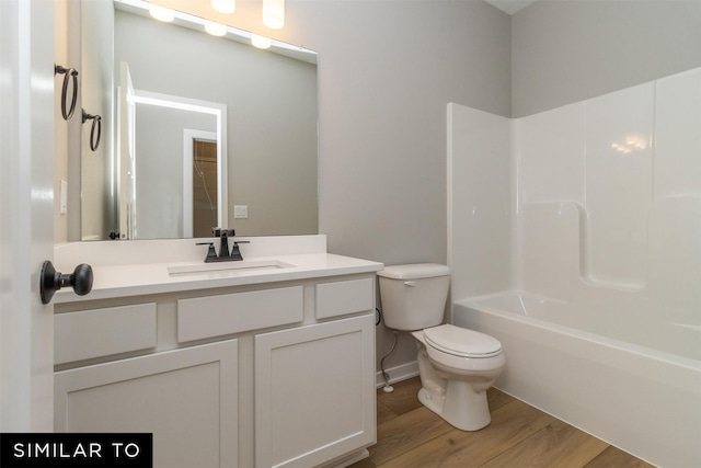 1435 Locust St, Waukee, IA 50263 - full bath featuring wood finished floors, vanity, and bathtub / shower combination