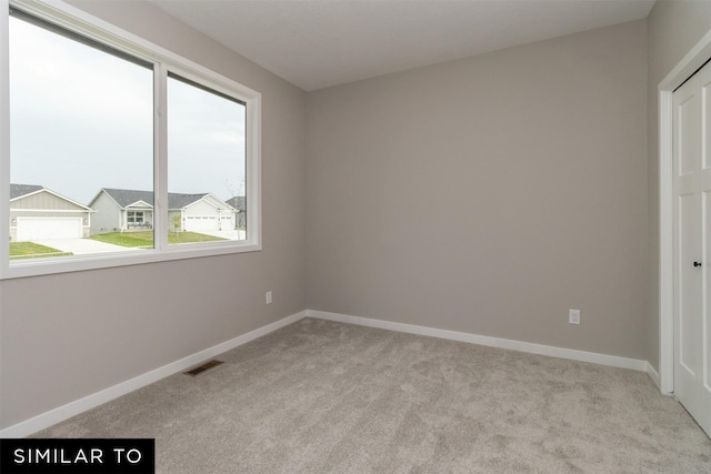 1435 Locust St, Waukee, IA 50263 - unfurnished room with light colored carpet
