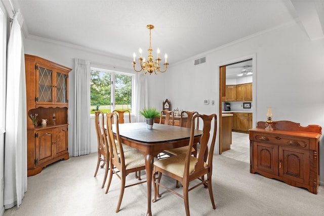 2207 Buchanan Dr, Ames, IA 50010 - dining area featuring a chandelier, ornamental molding, and light colored carpet